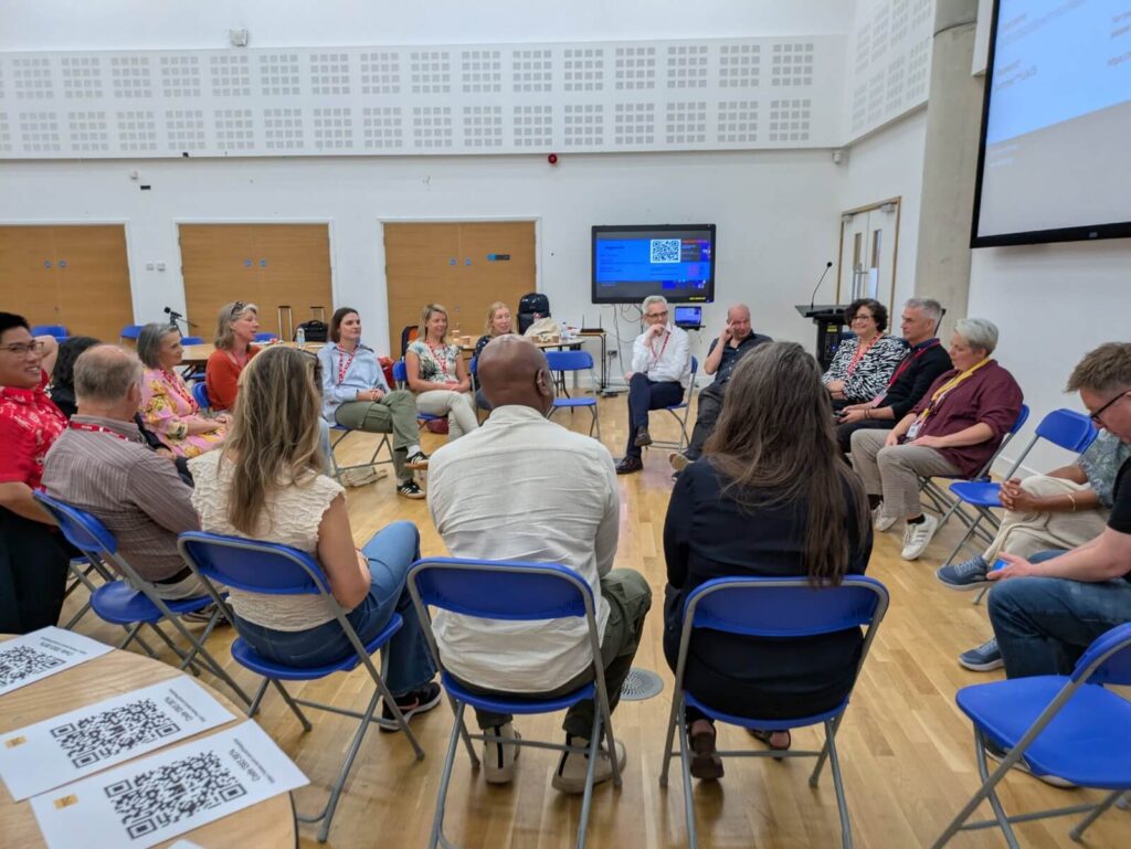 Engineering communication training workshop with 36 participants practicing psychological safety and social courage through applied improvisation exercises.